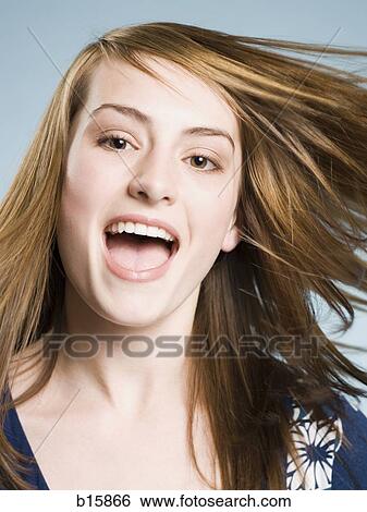Woman smiling with tossed hair View Large Photo Image Stock Photograph - Woman smiling with tossed hair. Fotosearch