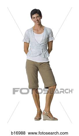 Stock Photo - Woman standing and smiling. Fotosearch