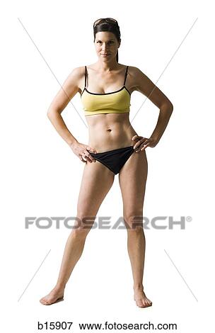 Stock Photo - Woman standing in bikini with hands on hips. Fotosearch