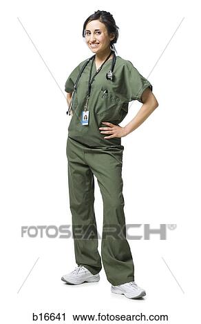 Woman standing in scrubs smiling View Large Photo Image Stock Image - Woman standing in scrubs smiling. Fotosearch
