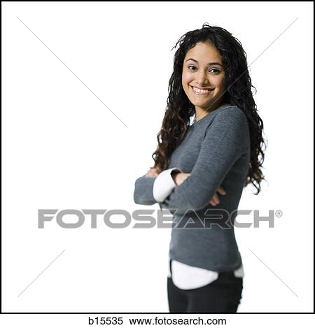 Woman standing with arms crossed smiling View Large Photo Image Stock Photography - Woman standing with arms crossed smiling. Fotosearch