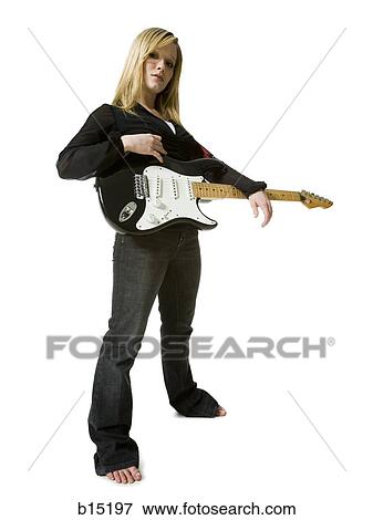 Woman standing with electric guitar View Large Photo Image Stock Photo - Woman standing with electric guitar. Fotosearch