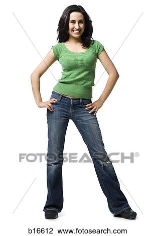 Woman standing with hands on hips smiling View Large Photo Image Stock Image - Woman standing with hands on hips smiling. Fotosearch
