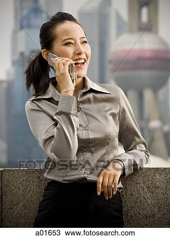 Woman talking on a mobile phone. View Large Photo Image Stock Image - Woman talking on a mobile phone.. Fotosearch