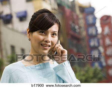 Woman with a cell phone. View Large Photo Image Stock Image - Woman with a cell phone.. Fotosearch