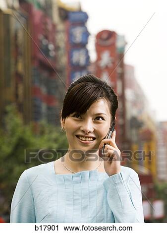 Woman with a cell phone. View Large Photo Image Stock Image - Woman with a cell phone.. Fotosearch