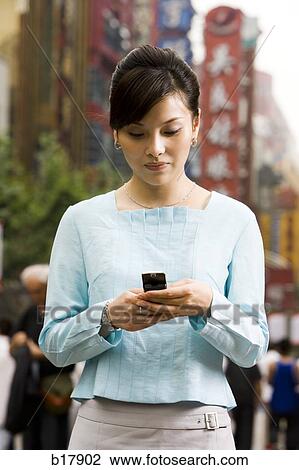 Woman with a cell phone. View Large Photo Image Stock Image - Woman with a cell phone.. Fotosearch