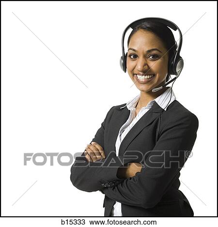 Woman with arms crossed and headset smiling View Large Photo Image Stock Image - Woman with arms crossed and headset smiling. Fotosearch