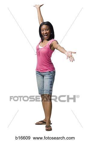 Stock Photo - Woman with arms up smiling. Fotosearch