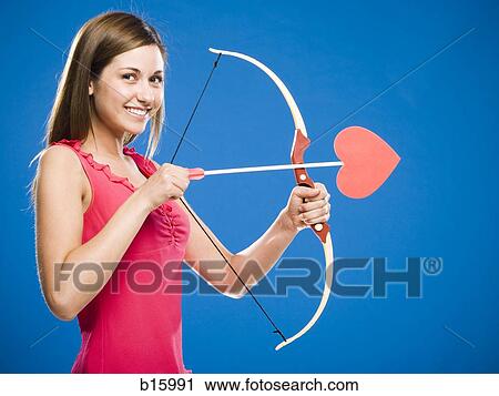 Woman with bow and arrow with heart View Large Photo Image Stock Image - Woman with bow and arrow with heart. Fotosearch