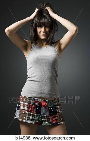 Woman with disheveled hair smiling View Large Photo Image Stock Photograph - Woman with disheveled hair smiling. Fotosearch