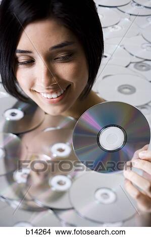 Picture - Woman with DVDs. Fotosearch