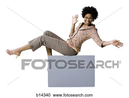 Woman with eyeglasses sitting on blank sign View Large Photo Image Stock Image - Woman with eyeglasses sitting on blank sign. Fotosearch