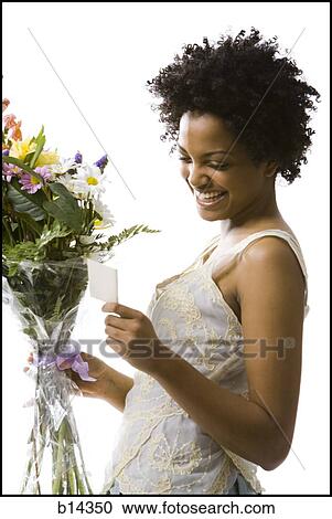 Stock Image - woman with flowers. Fotosearch