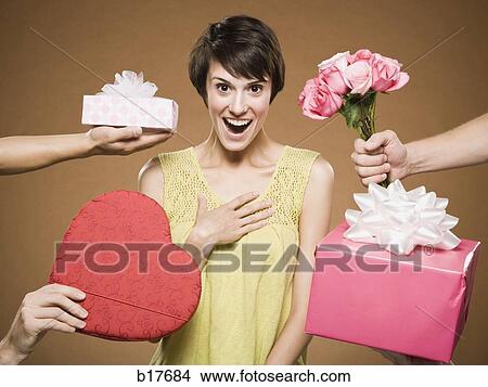 Woman with four men giving presents View Large Photo Image Picture - Woman with four men giving presents. Fotosearch