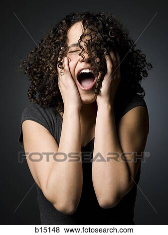 Woman with mouth open and closed eyes with hands on face View Large Photo Image Stock Photo - Woman with mouth open and closed eyes with hands on face. Fotosearch