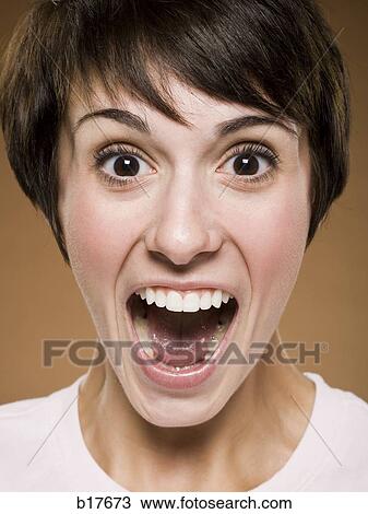 Woman with mouth open excitedly View Large Photo Image Stock Image - Woman with mouth open excitedly. Fotosearch
