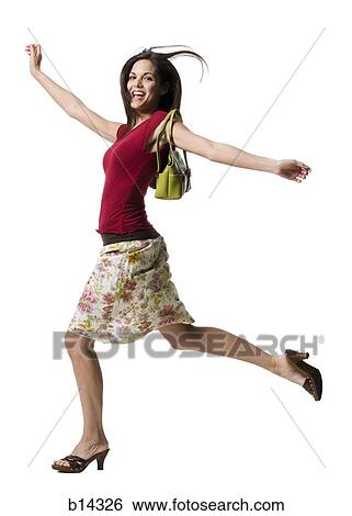 Woman with purse running and smiling View Large Photo Image Stock Photograph - Woman with purse running and smiling. Fotosearch