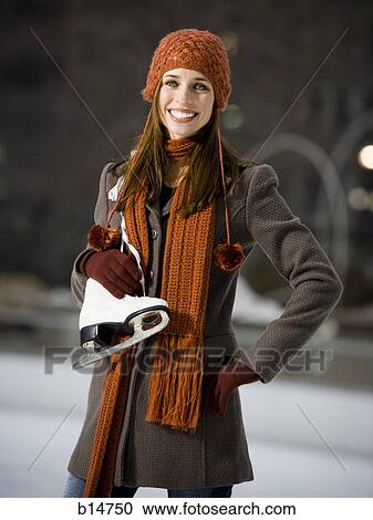 Woman with skates outdoors in winter smiling View Large Photo Image Stock Image - Woman with skates outdoors in winter smiling. Fotosearch