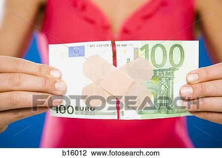 Woman with torn one hundred dollar euro banknote with plastic strips View Large Photo Image Stock Image - Woman with torn one hundred dollar euro banknote with plastic strips. Fotosearch
