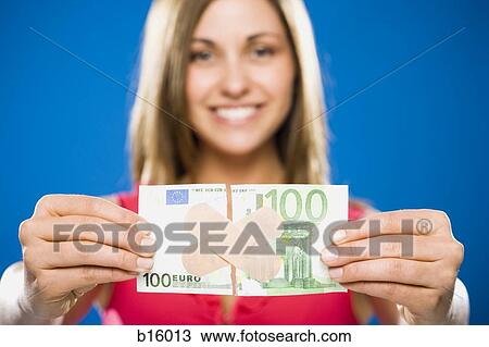 Woman with torn one hundred dollar euro banknote with plastic strips View Large Photo Image Stock Image - Woman with torn one hundred dollar euro banknote with plastic strips. Fotosearch