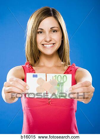 Woman with torn one hundred dollar euro banknote with plastic strips View Large Photo Image Stock Photography - Woman with torn one hundred dollar euro banknote with plastic strips. Fotosearch