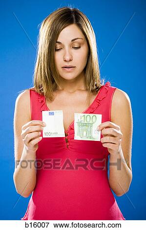 Woman with torn one hundred euro banknote View Large Photo Image Stock Photo - Woman with torn one hundred euro banknote. Fotosearch
