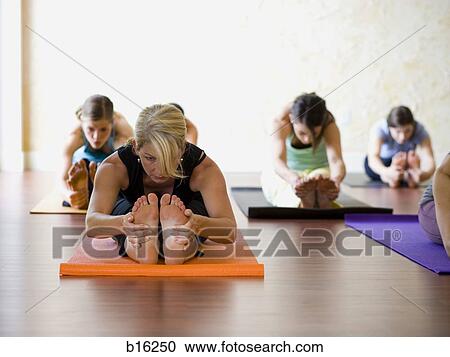 Women at yoga class View Large Photo Image Stock Image - Women at yoga class. Fotosearch