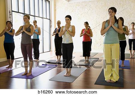 Women at yoga class View Large Photo Image Stock Image - Women at yoga class. Fotosearch