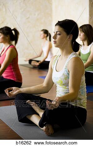 Women at yoga class View Large Photo Image Stock Image - Women at yoga class. Fotosearch