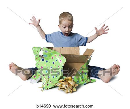 Young boy opening present View Large Photo Image Stock Image - Young boy opening present. Fotosearch