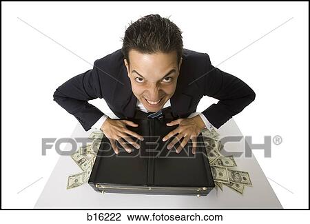 Young businessman with banknotes falling out of briefcase View Large Photo Image Stock Image - Young businessman with banknotes falling out of briefcase. Fotosearch
