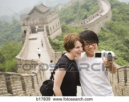 Young couple at the Great Wall of China. View Large Photo Image Stock Photo - Young couple at the Great Wall of China.. Fotosearch
