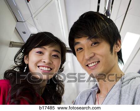 Stock Photography - Young couple smiling. Fotosearch
