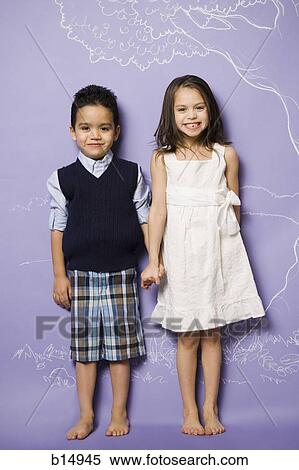 Young girl and boy holding hands smiling View Large Photo Image Stock Photography - Young girl and boy holding hands smiling. Fotosearch