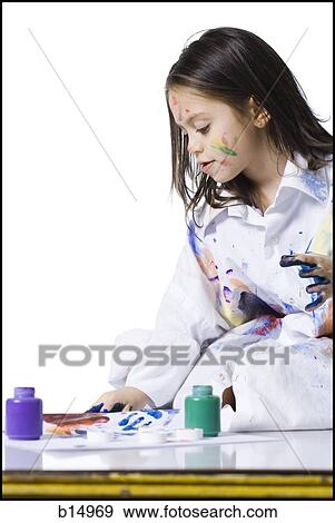 Young girl finger painting View Large Photo Image Stock Photo - Young girl finger painting. Fotosearch