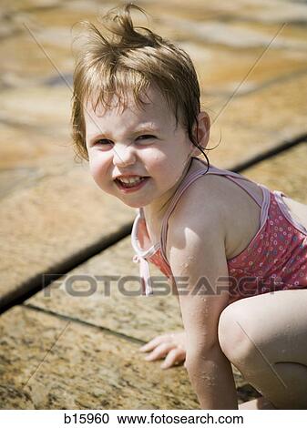 Young girl smiling outdoors View Large Photo Image Stock Image - Young girl smiling outdoors. Fotosearch