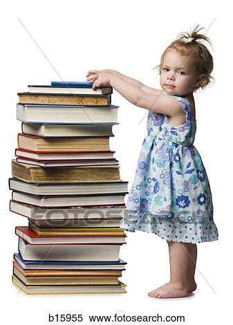 Young girl standing beside pile of hardcover books View Large Photo Image Stock Photography - Young girl standing beside pile of hardcover books. Fotosearch