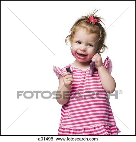 Young girl with lipstick on face smiling View Large Photo Image Stock Photo - Young girl with lipstick on face smiling. Fotosearch