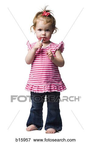 Young girl with lipstick on face View Large Photo Image Stock Photo - Young girl with lipstick on face. Fotosearch