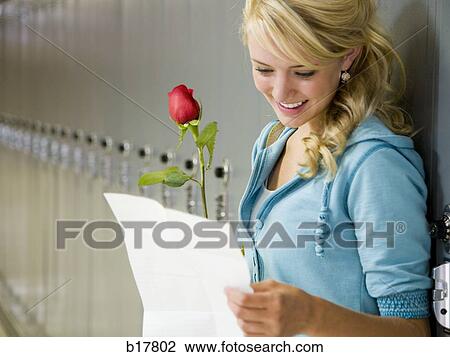 Young woman reading a love letter. View Large Photo Image Stock Image - Young woman reading a love letter.. Fotosearch
