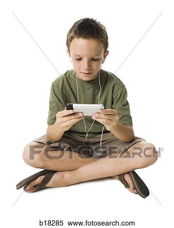 A boy and his iPhone. View Large Photo Image Stock Photography - A boy and his iPhone.. Fotosearch