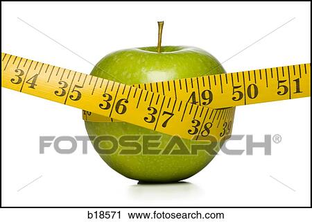 Apple with a measuring tape around it. View Large Photo Image Stock Image - Apple with a measuring tape around it.. Fotosearch