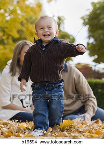 baby boy walking in leaves View Large Photo Image Picture - baby boy walking in leaves. Fotosearch