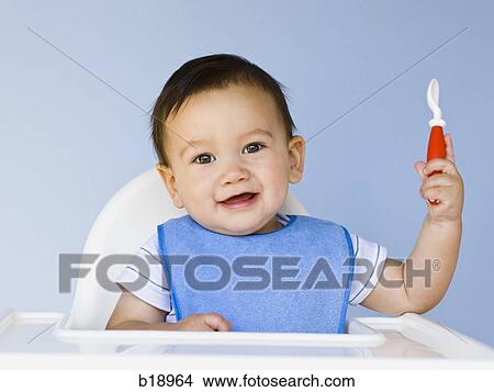 baby boy with a blue bib. View Large Photo Image Picture - baby boy with a blue bib.. Fotosearch