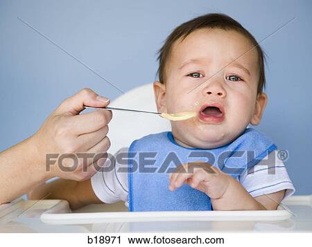baby boy with a blue bib. View Large Photo Image Stock Image - baby boy with a blue bib.. Fotosearch