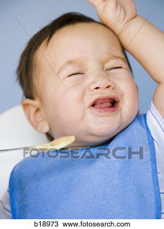 baby boy with a blue bib. View Large Photo Image Stock Image - baby boy with a blue bib.. Fotosearch
