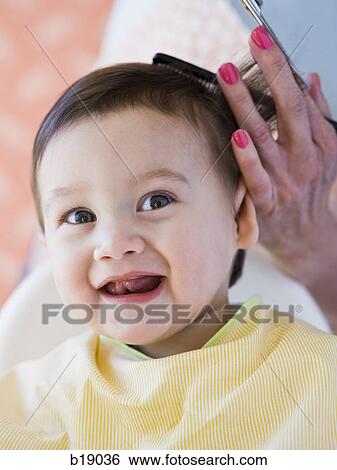 Baby getting a haircut. View Large Photo Image Stock Photograph - Baby getting a haircut.. Fotosearch