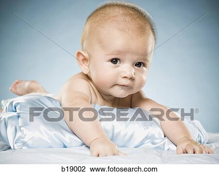 baby on a blue blanket. View Large Photo Image Stock Image - baby on a blue blanket.. Fotosearch