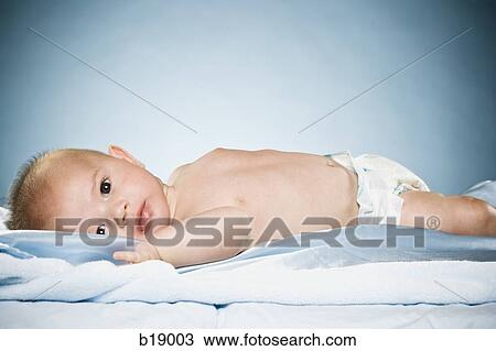 baby on a blue blanket. View Large Photo Image Stock Image - baby on a blue blanket.. Fotosearch